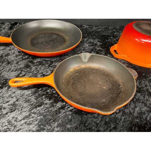 299 - THREE PIECES OF LE CREUSET ONE BEING LARGE WOODEN HANDLE FRYING PAN TWO ROUND SKILLETS AND ONE OTHER... 