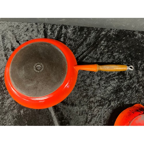 299 - THREE PIECES OF LE CREUSET ONE BEING LARGE WOODEN HANDLE FRYING PAN TWO ROUND SKILLETS AND ONE OTHER... 