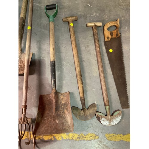 304 - LARGE COLLECTION OF GARDEN TOOLS TO INCLUDE SPADES SAWS ETC