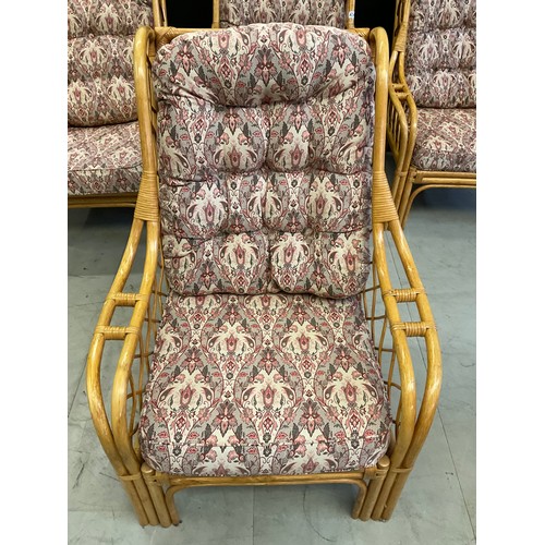 434 - FOUR  CANE UPHOLSTERED CONSERVATORY ARMCHAIRS