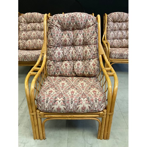 434 - FOUR  CANE UPHOLSTERED CONSERVATORY ARMCHAIRS