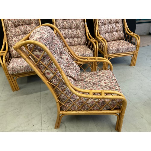 434 - FOUR  CANE UPHOLSTERED CONSERVATORY ARMCHAIRS