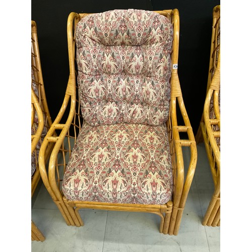 434 - FOUR  CANE UPHOLSTERED CONSERVATORY ARMCHAIRS