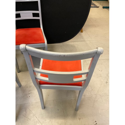 435 - SEVEN GREY PAINTED WOODEN CHAIRS WITH ORANGE UPHOLSTERED SEATS