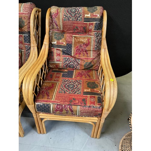 447 - PAIR OF CANE CONSERVATORY ARMCHAIRS WITH UPHOLSTERED CUSHIONS