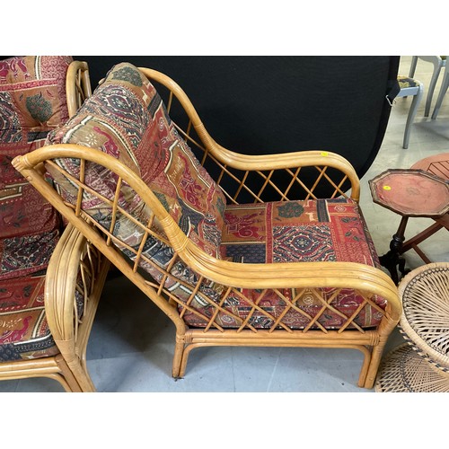 447 - PAIR OF CANE CONSERVATORY ARMCHAIRS WITH UPHOLSTERED CUSHIONS