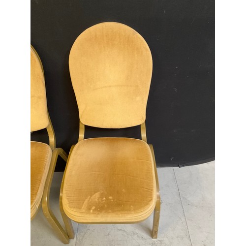 452 - ELEVEN GOLD COLOURED STACKABLE THEATRE/FUNCTION CHAIRS