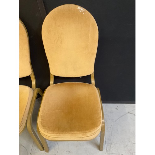 452 - ELEVEN GOLD COLOURED STACKABLE THEATRE/FUNCTION CHAIRS