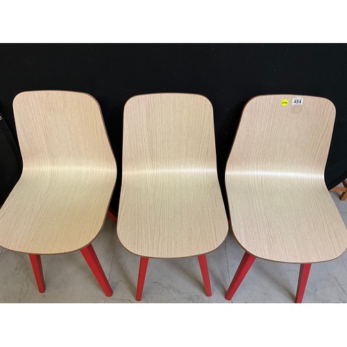 454 - SEVEN  WOODEN CAFE CHAIRS WITH RED PAINTED LEGS