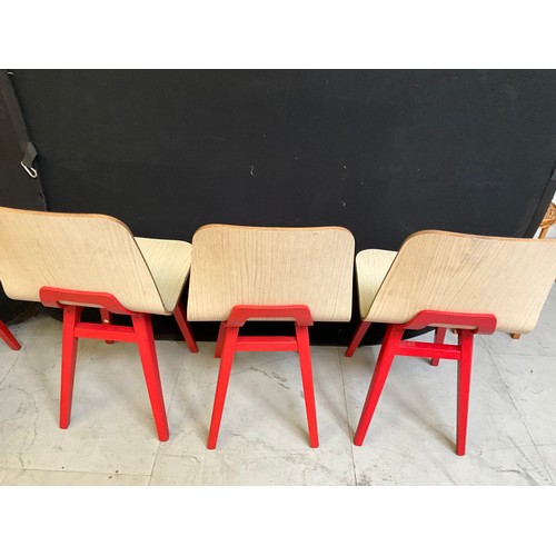 454 - SEVEN  WOODEN CAFE CHAIRS WITH RED PAINTED LEGS