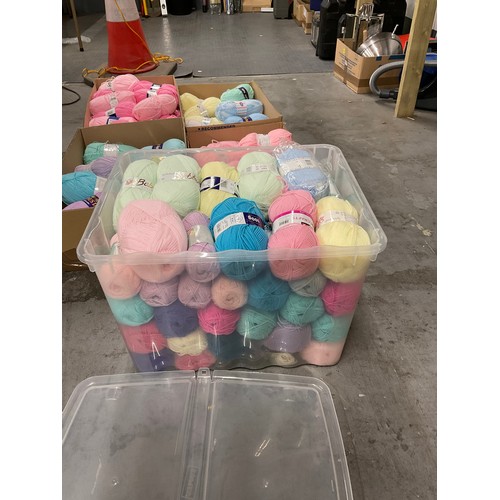 20 - FOUR BOXES AND A PLASTIC CRATE FULL OF BALLS OF WOOL