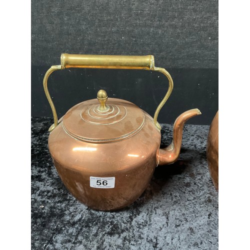 56 - TWO VINTAGE COPPER KETTLES EACH WITH BRASS FINNEAL HANDLES