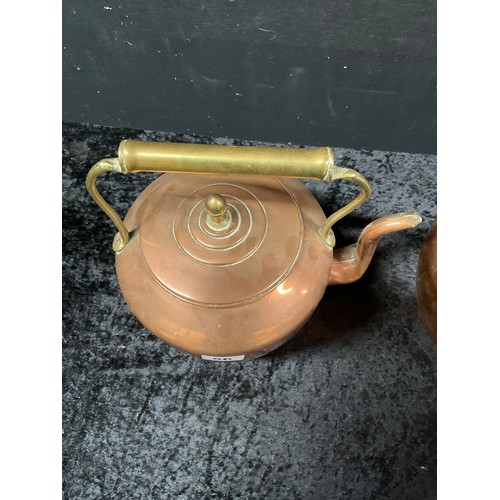 56 - TWO VINTAGE COPPER KETTLES EACH WITH BRASS FINNEAL HANDLES