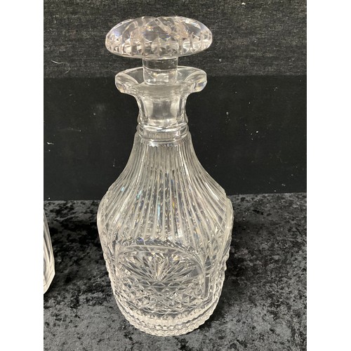 94 - FOUR CUT GLASS DECANTERS ONE WITH SILVER TOP