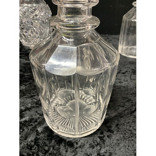 94 - FOUR CUT GLASS DECANTERS ONE WITH SILVER TOP