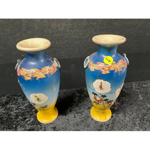 99 - PAIR OF ORIENTAL STYLE VASES DECORATED WITH FLOWERS H12