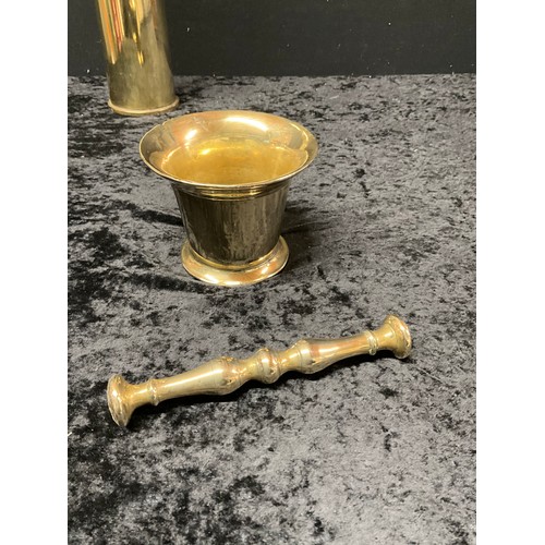 129 - ANTIQUE BRASS SHELL CASE AND PESTLE AND MORTAR