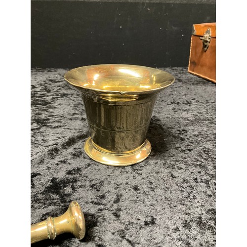 129 - ANTIQUE BRASS SHELL CASE AND PESTLE AND MORTAR