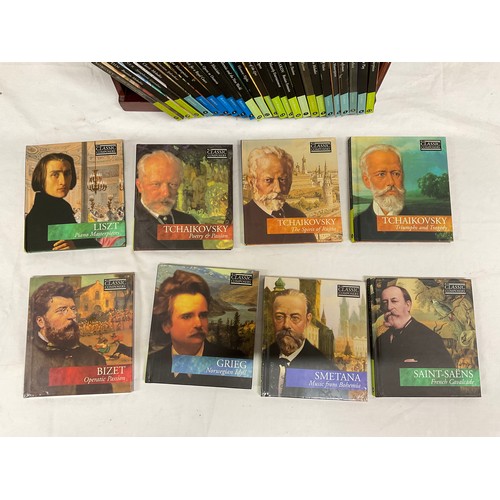 165 - SET OF CLASSIC COMPOSERS CDS ON FITTED WOODEN STAND