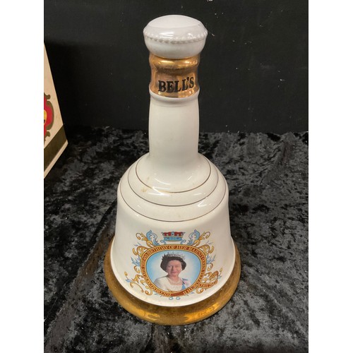 174 - TWO BOXED COMMERATIVE WEIGHED BELLS ONE FOR HER MAJESTYS QUUEN ELIZABETH 60TH BIRTHDAY 1986 AND 1981... 