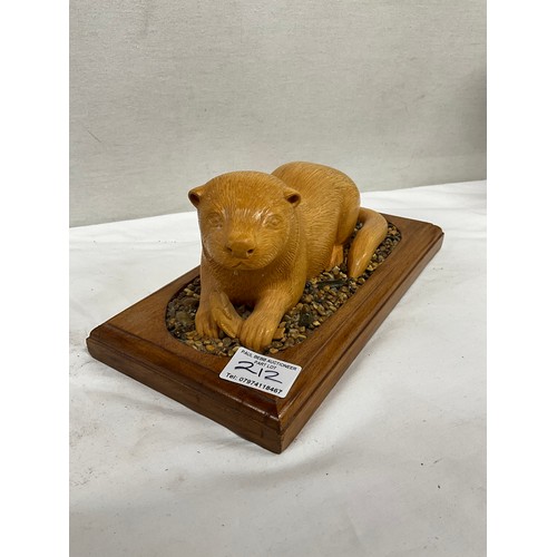 212 - THREE CARVED WOODEN ANIMAL SCENE FIGURINES TO INCLUDE COCKREL,OTTER AND SHEPHERD WITH SHEEP