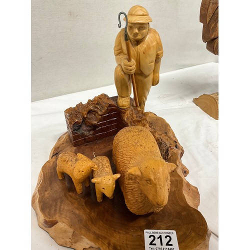 212 - THREE CARVED WOODEN ANIMAL SCENE FIGURINES TO INCLUDE COCKREL,OTTER AND SHEPHERD WITH SHEEP