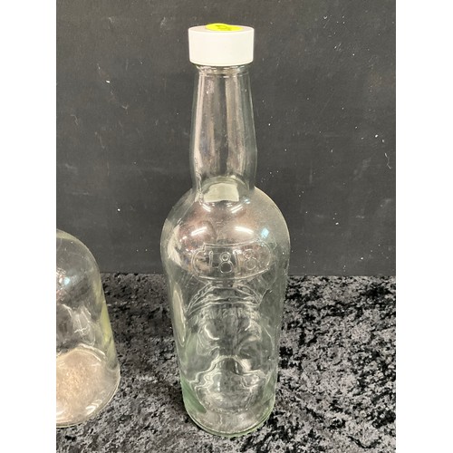 258 - LARGE SMIRNOFF EMBOSSED GLASS BOTTLE AND ONE OTHER