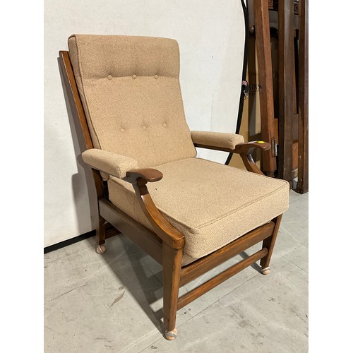 299 - UPHOLSTERED BEECH ARM CHAIR ON CASTERS