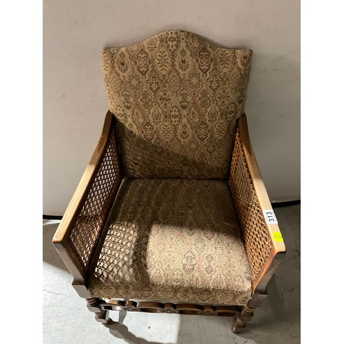 313 - BEECH FRAMED UPHOLSTERED ARM CHAIR WITH BERGERE PANELS