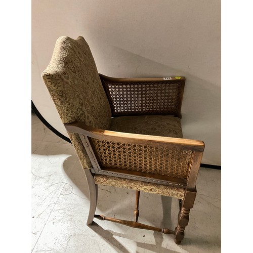 313 - BEECH FRAMED UPHOLSTERED ARM CHAIR WITH BERGERE PANELS