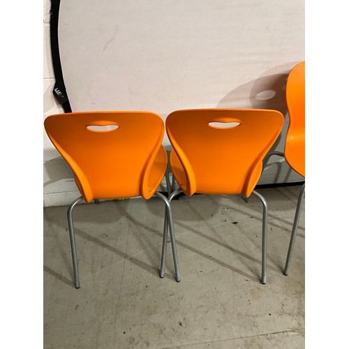 319A - FIVE RETRO PLASTIC ORANGE STACKING CHAIRS