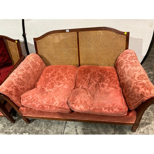 323 - EDWARDIAN MAHOGANY BERGERE TWO SEATER SOFA AND MATCHING ARM CHAIR