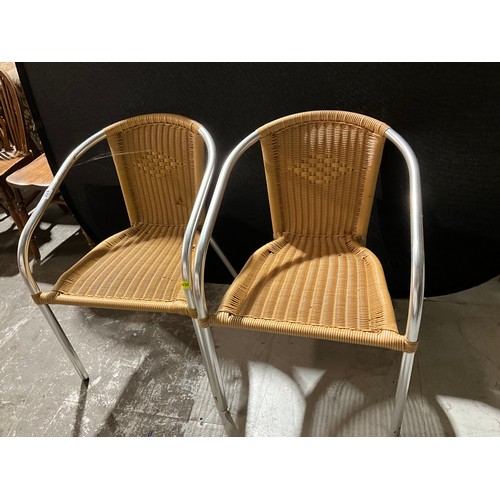 324 - TWO MODERN METAL FRAMED STACKING ARM CHAIRS