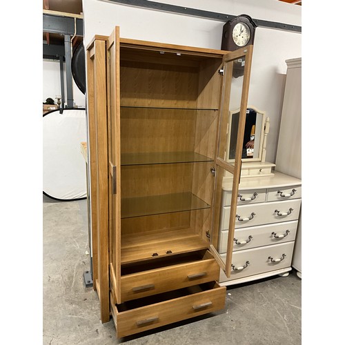 357 - MODERN TWO DOOR GLAZED OAK DISPLAY CABINET WITH TWO DRAWERS TO BASE W36