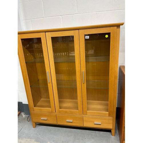 405 - MODERN GOLDEN OAK THREE DOOR GLAZED DISPLAY CABINET WITH THREE DRAWERS TO BASE W50