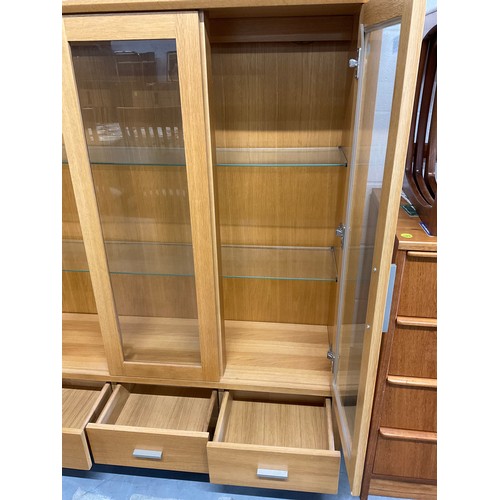 405 - MODERN GOLDEN OAK THREE DOOR GLAZED DISPLAY CABINET WITH THREE DRAWERS TO BASE W50