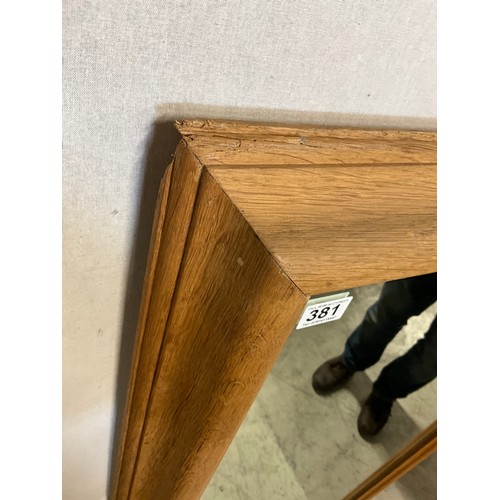 381 - LARGE OAK FRAMED WALL MIRROR 33