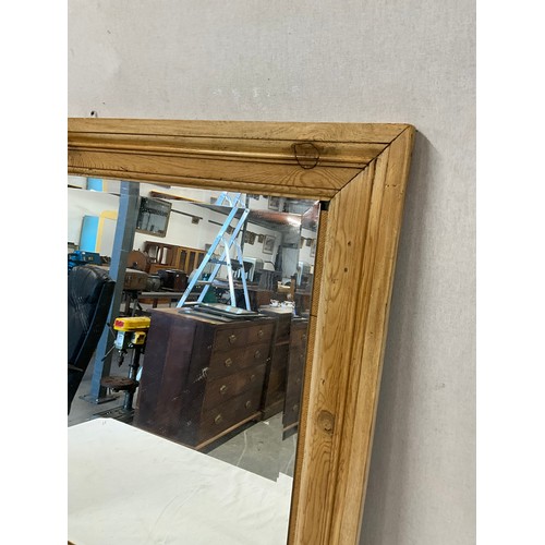 384 - PINE FRAMED BEVELLED EDGED WALL MIRROR 29