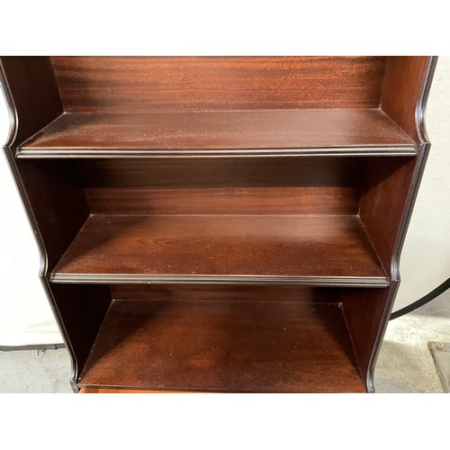 478 - MODERN MAHOGANY WATERFALL BOOK CASE WITH DRAWER TO BASE LABELLED ROSSMORE FURNITURE H46