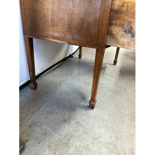 474 - EDWARDIAN MAHOGANY KNEE HOLE BOW FRONTED DESK OF SMALL PROPORTIONS WITH TWO DRAWERS OVER TWO DOORS O... 