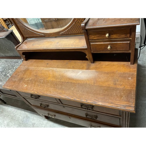 445 - EDWARDIAN OAK DRESSING TABLE WITH OVAL FRAMED MIRROR FLANKED BY TWO JEWELLERY DRAWERS OVER FOUR DRAW... 