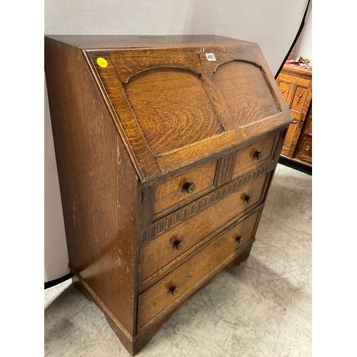 480 - VINTAGE PRIORY STYLE OAK BUREAU WITH FITTED INTERIOR OVER THREE DRAWERS COMPLETE WITH KEY H40