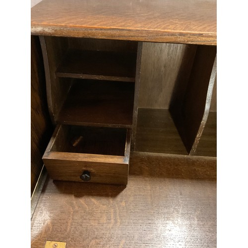 480 - VINTAGE PRIORY STYLE OAK BUREAU WITH FITTED INTERIOR OVER THREE DRAWERS COMPLETE WITH KEY H40