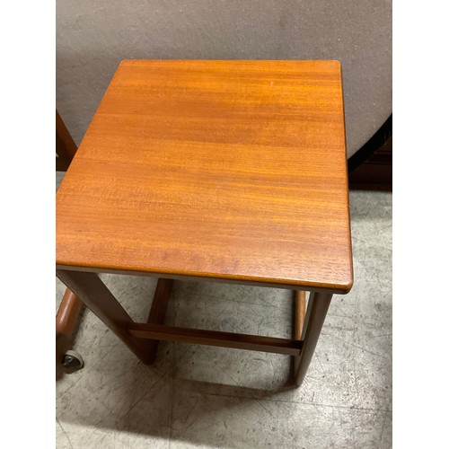 491 - MID CENTURY BADGED MACINTOSH TEAK NEST OF TABLES WITH FOLDING SWIVEL TOP