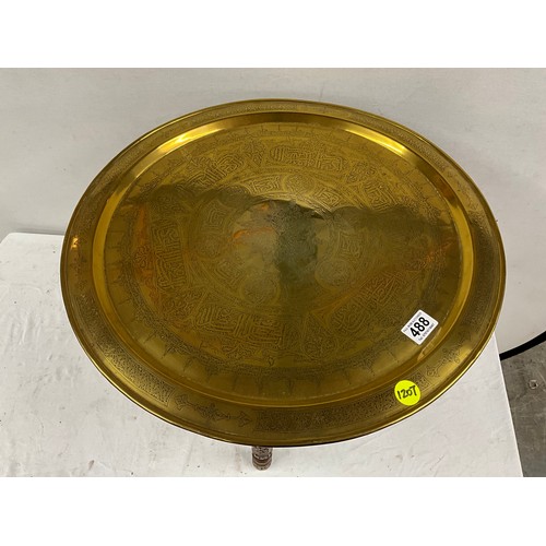 488 - VINTAGE BRASS TRAY TOP FOLDING TABLE ON CARVED BASE H18