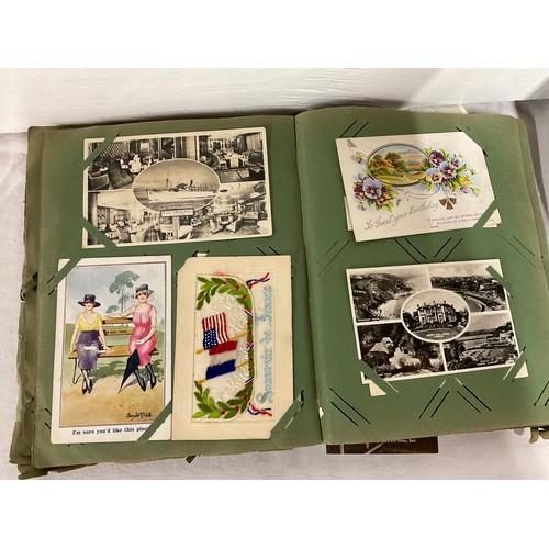 64 - POSTCARD ALBUM AND TIN OF POSTCARDS TO INCLUDE VARIOUS SUBJECTS TO INCLUDE THE WAR, SHIPS RAILWAY, V... 