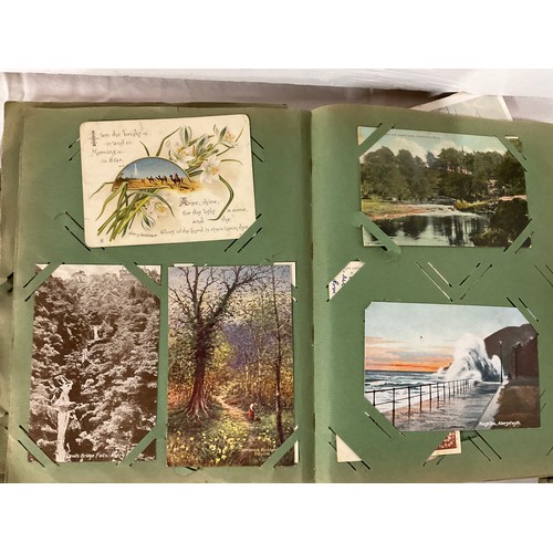 64 - POSTCARD ALBUM AND TIN OF POSTCARDS TO INCLUDE VARIOUS SUBJECTS TO INCLUDE THE WAR, SHIPS RAILWAY, V... 