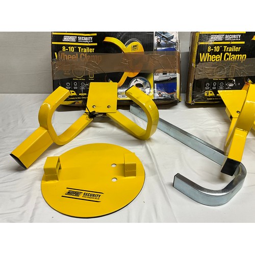 98 - 2 BOXED TRAILER WHEEL CLAMPS