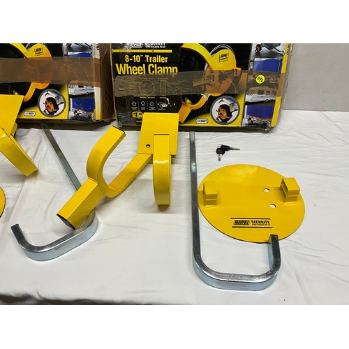 98 - 2 BOXED TRAILER WHEEL CLAMPS