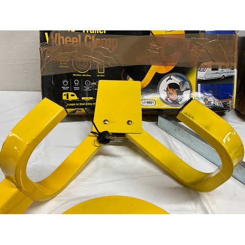 98 - 2 BOXED TRAILER WHEEL CLAMPS